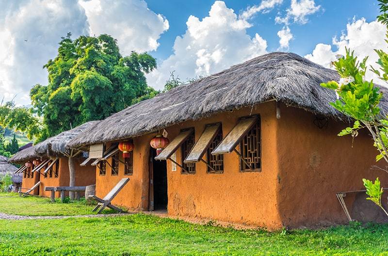 vintage cob house with garden in chinese village, northern thail